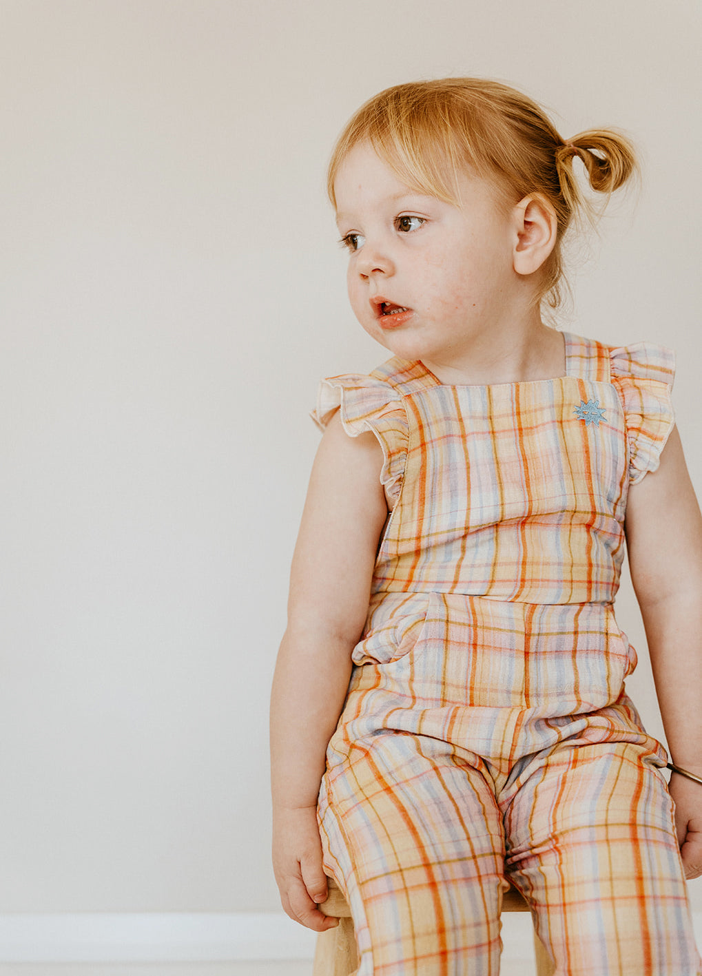 Kapow Kids Girls Rainbow Plaid Ruffle Dungarees | Rompers & Playsuits | Bon Bon Tresor