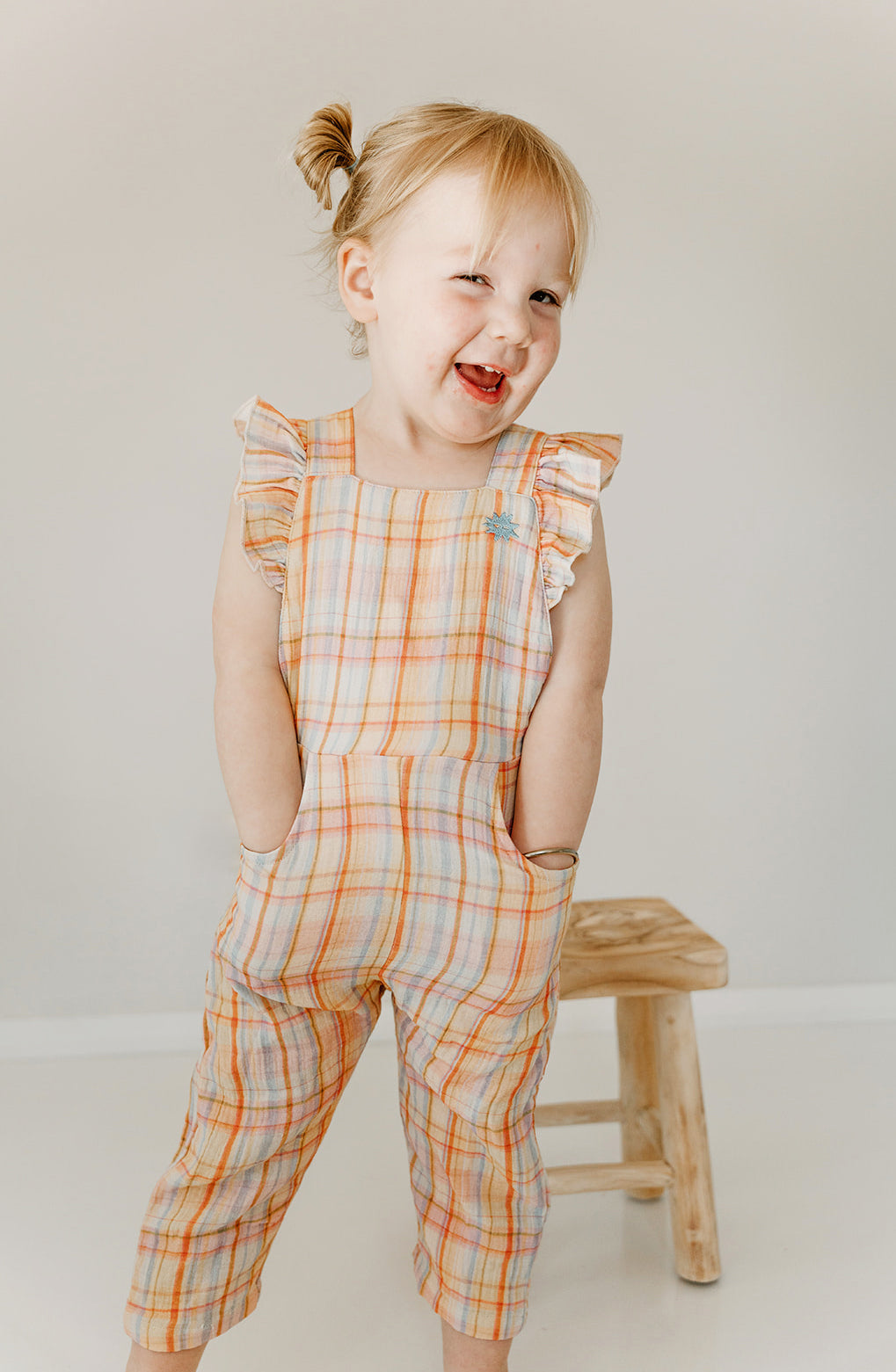 Kapow Kids Girls Rainbow Plaid Ruffle Dungarees | Rompers & Playsuits | Bon Bon Tresor
