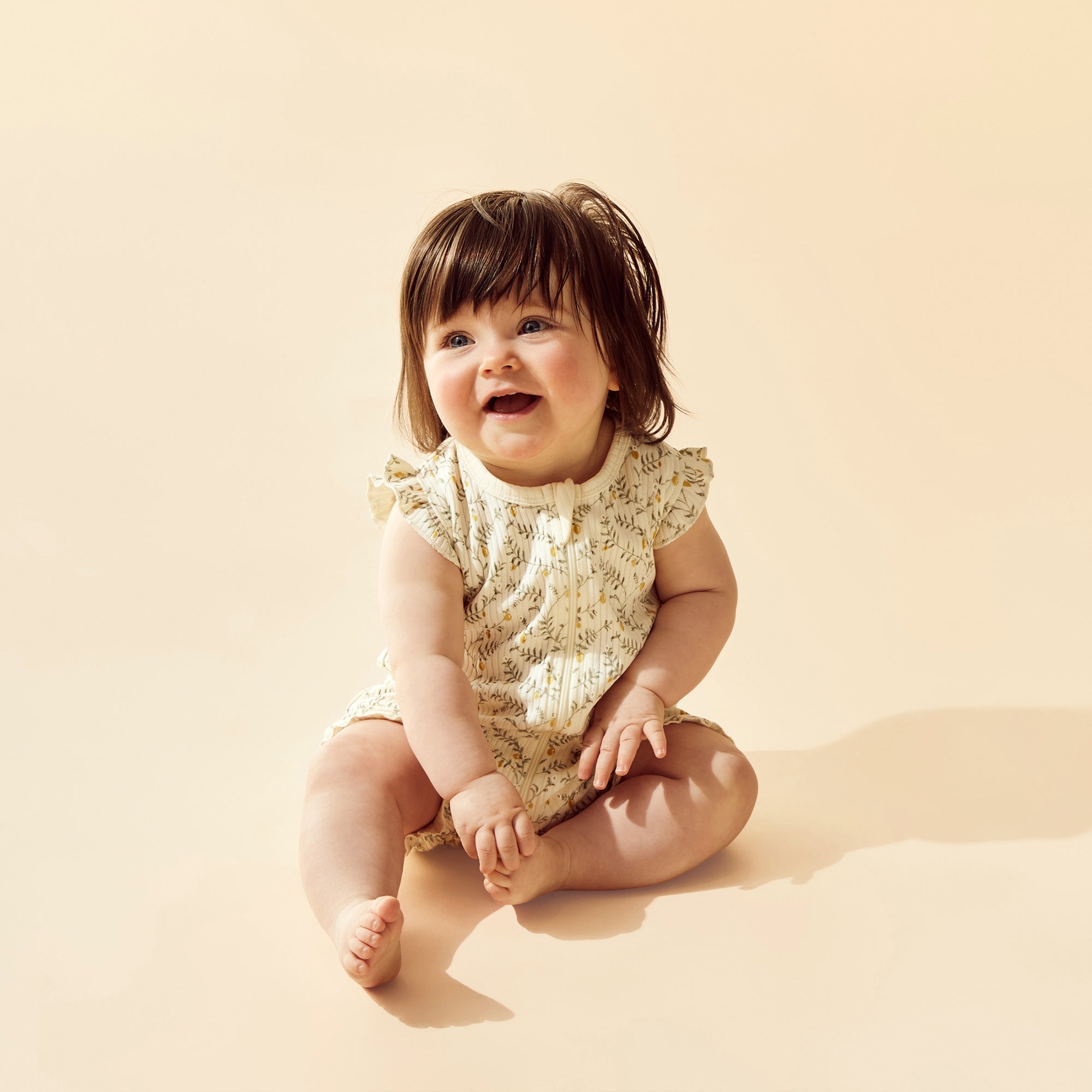 Wilson and Frenchy Lemon Leaf Organic Ruffle Zipsuit